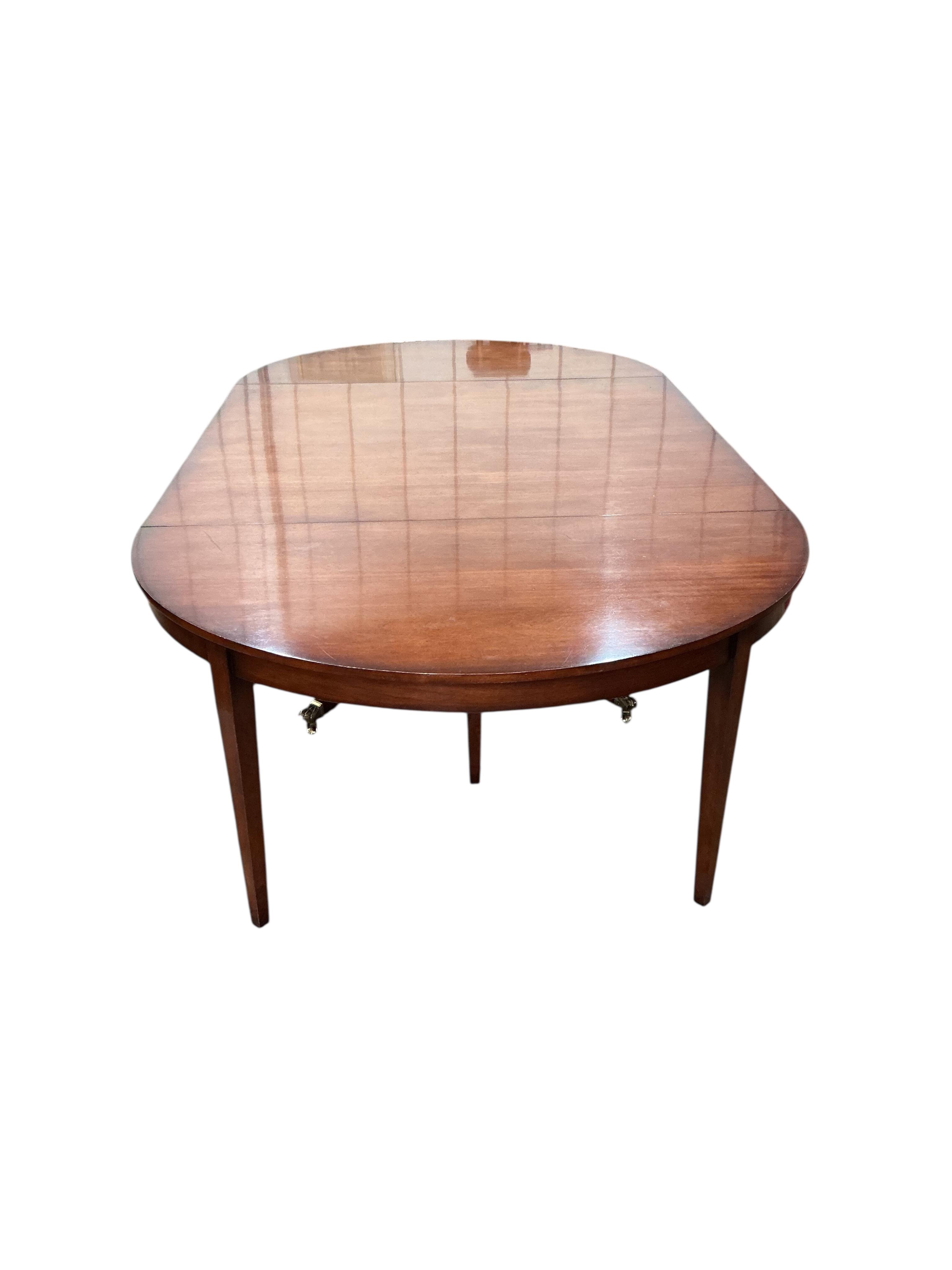 A reproduction George III style mahogany D end dining table, width 305cm extended, depth 145cm, height 74cm